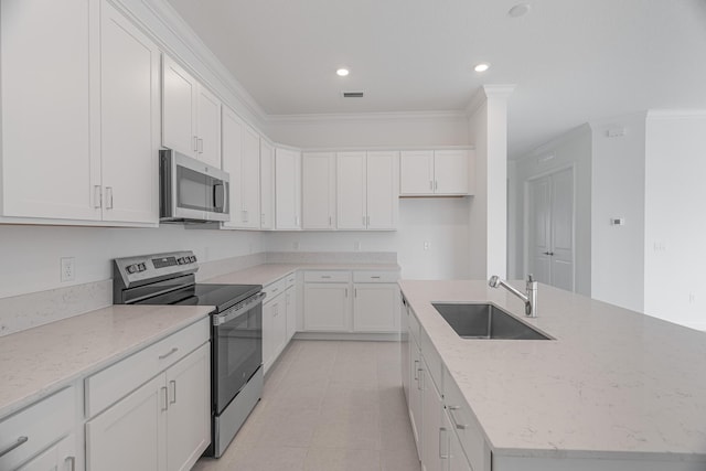 kitchen featuring stainless steel appliances, white cabinetry, sink, and crown molding