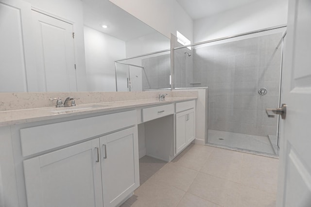 bathroom featuring vanity, an enclosed shower, and tile patterned flooring