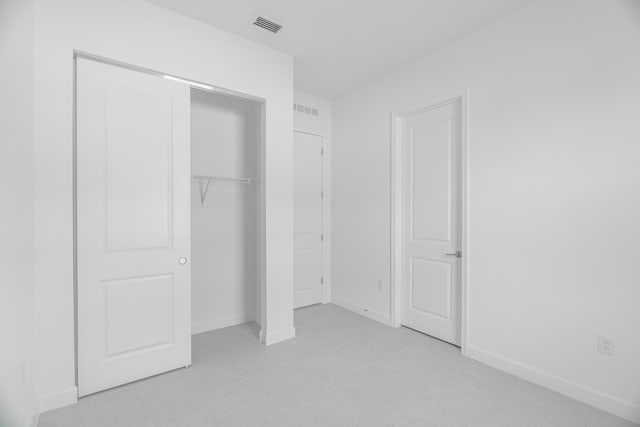 unfurnished bedroom with a closet