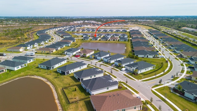 bird's eye view with a water view