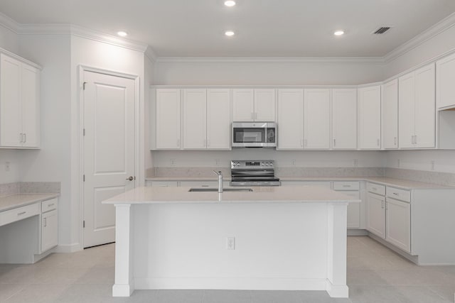 kitchen with white cabinetry, stainless steel appliances, sink, and a kitchen island with sink