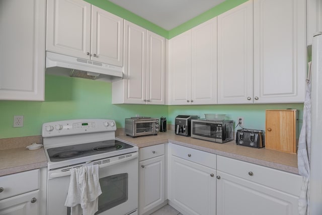 kitchen featuring white cabinets and white appliances