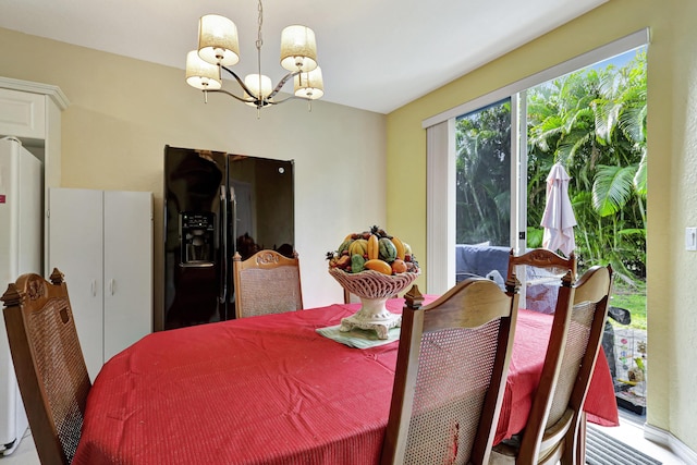 dining area featuring a chandelier