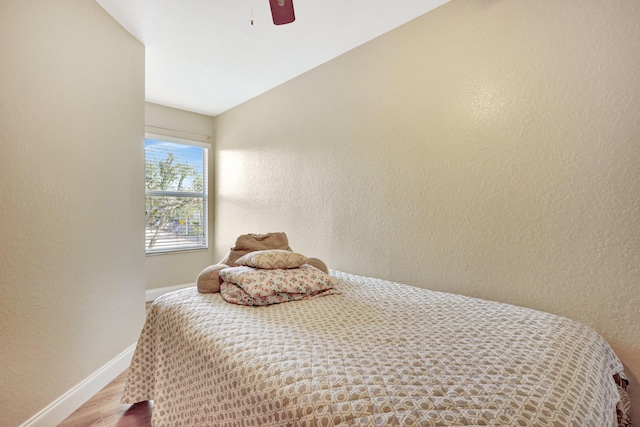 bedroom featuring hardwood / wood-style flooring and ceiling fan