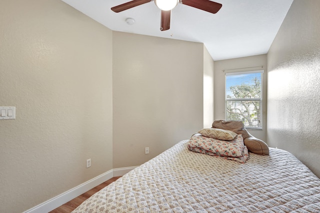 bedroom featuring ceiling fan and wood-type flooring