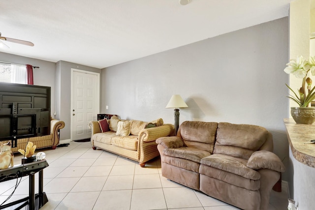 tiled living room featuring ceiling fan