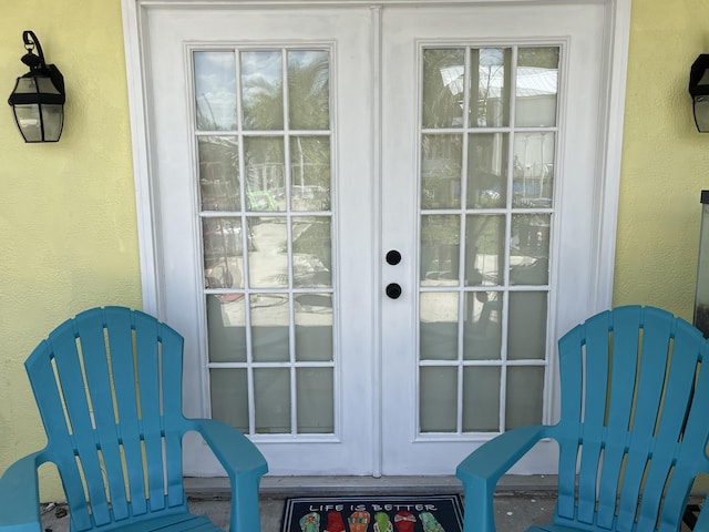 doorway to outside featuring a textured wall