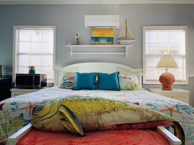 bedroom featuring an AC wall unit, multiple windows, and ornamental molding
