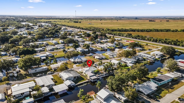 view of property location featuring nearby suburban area and a nearby body of water