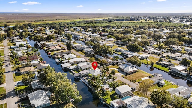 bird's eye view featuring a water view and a residential view