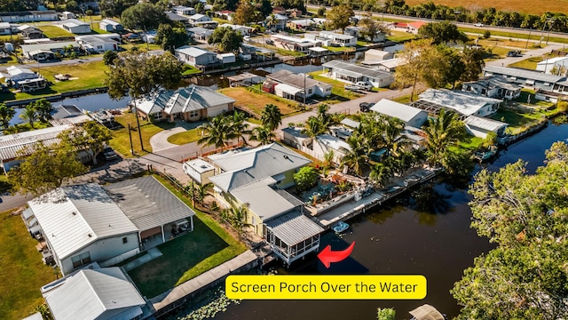 aerial perspective of suburban area featuring a nearby body of water