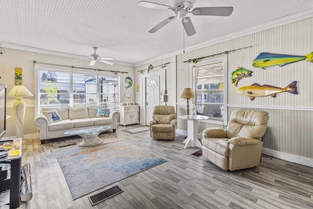 dining space featuring crown molding, ceiling fan, and hardwood / wood-style floors