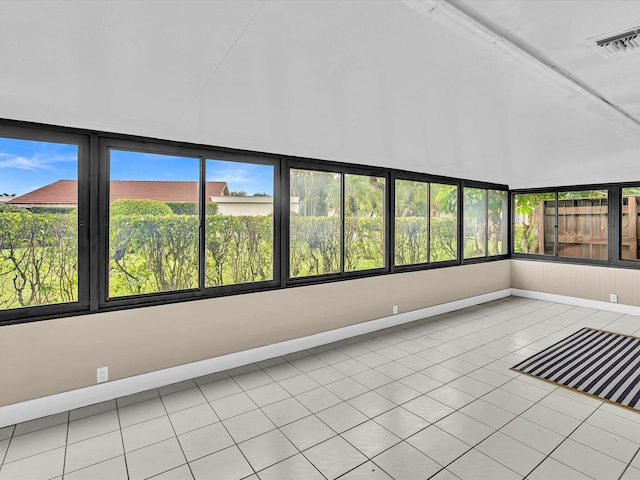 unfurnished sunroom featuring a wealth of natural light