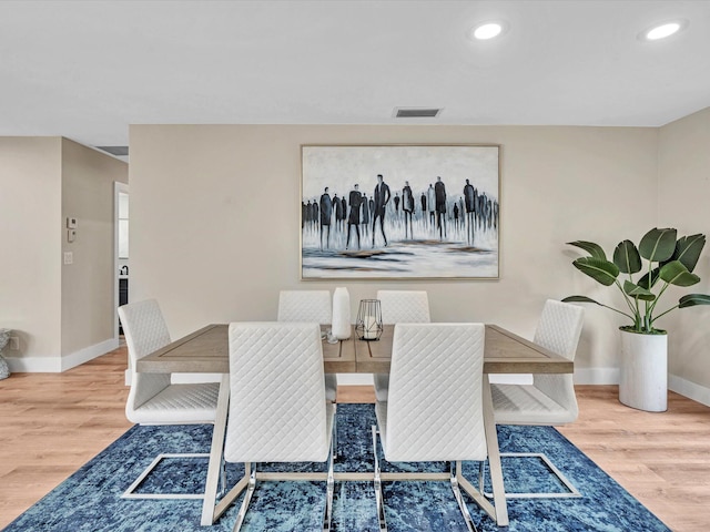 dining area featuring wood-type flooring