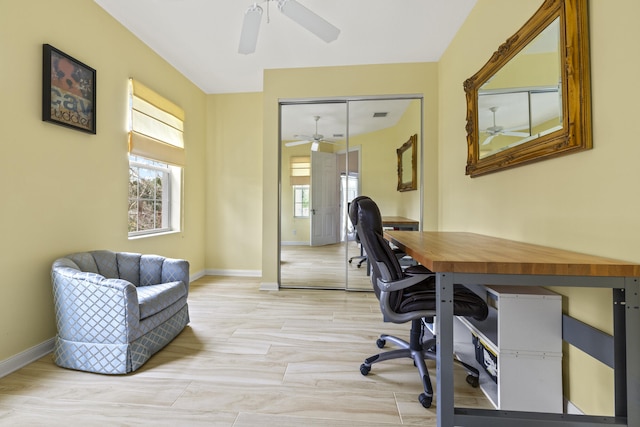 office with ceiling fan, visible vents, baseboards, and light wood-style flooring