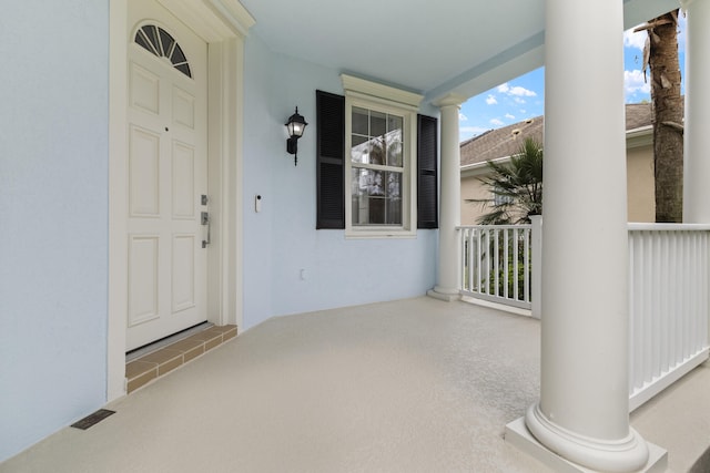 property entrance with stucco siding