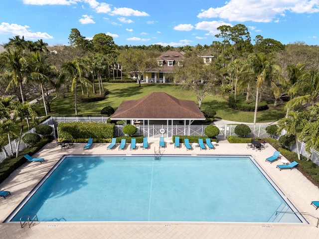 pool featuring a patio area and fence