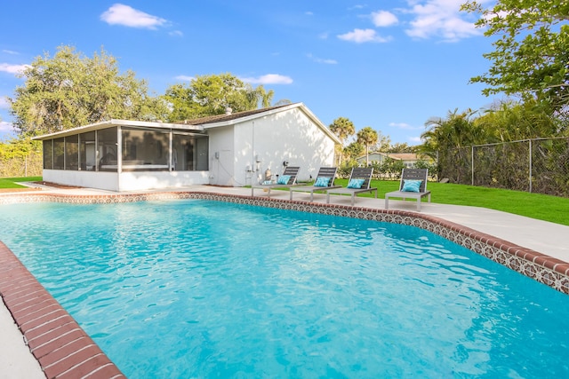 131 Jay Ct, Royal Palm Beach, FL 33411 - swimming pool with a sunroom