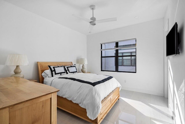 bedroom featuring light tile patterned flooring and ceiling fan