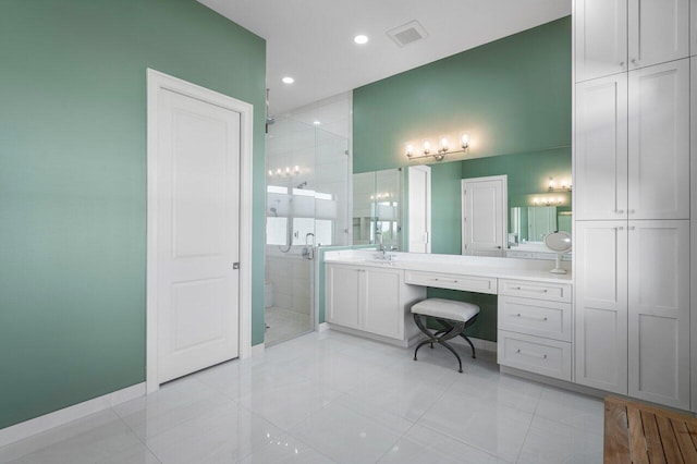 bathroom featuring vanity, an enclosed shower, and tile patterned flooring