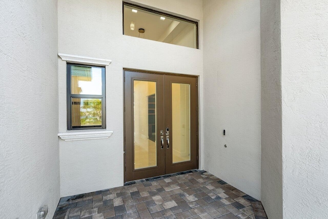 view of exterior entry featuring french doors