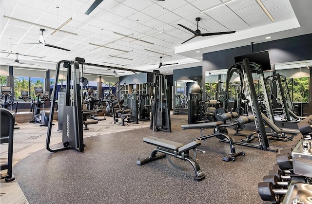 exercise room with ceiling fan