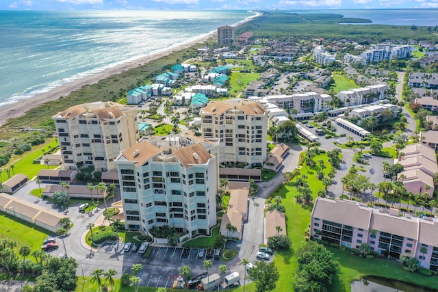 drone / aerial view with a view of the beach and a water view