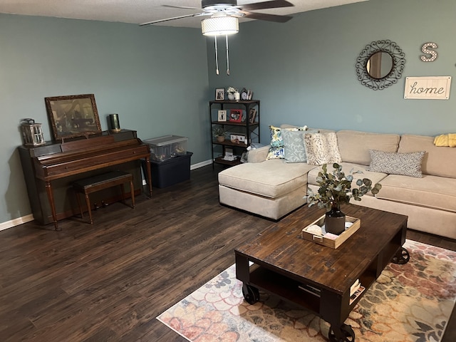 living room featuring dark hardwood / wood-style flooring and ceiling fan