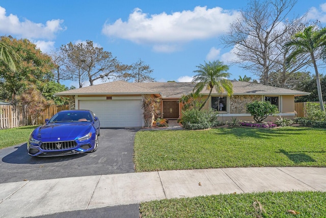 single story home with a garage and a front yard