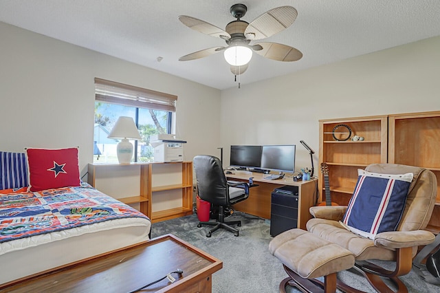 bedroom with a textured ceiling, light colored carpet, and ceiling fan