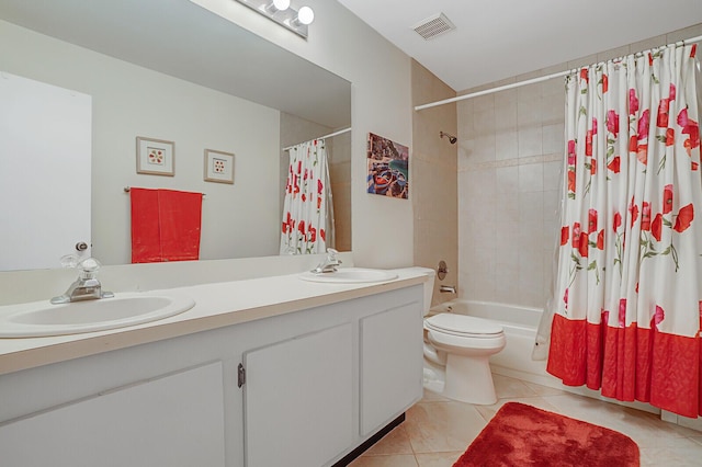 full bathroom featuring tile patterned flooring, vanity, toilet, and shower / bath combo