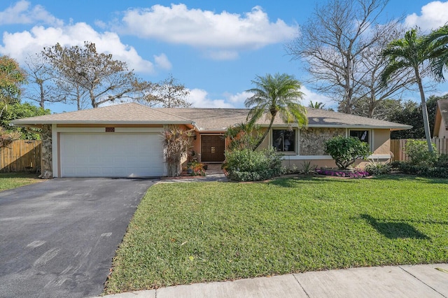 single story home with a garage and a front lawn