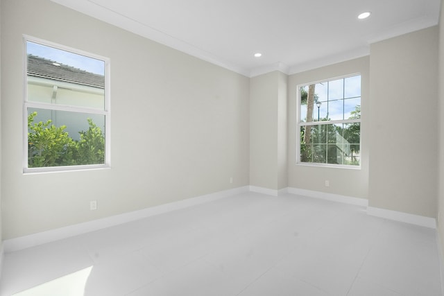 unfurnished room with baseboards, ornamental molding, and recessed lighting