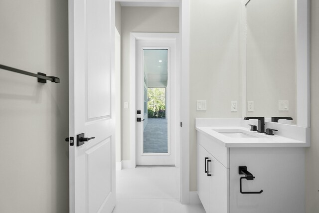 bathroom with tile patterned flooring and vanity