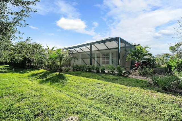 view of yard featuring glass enclosure