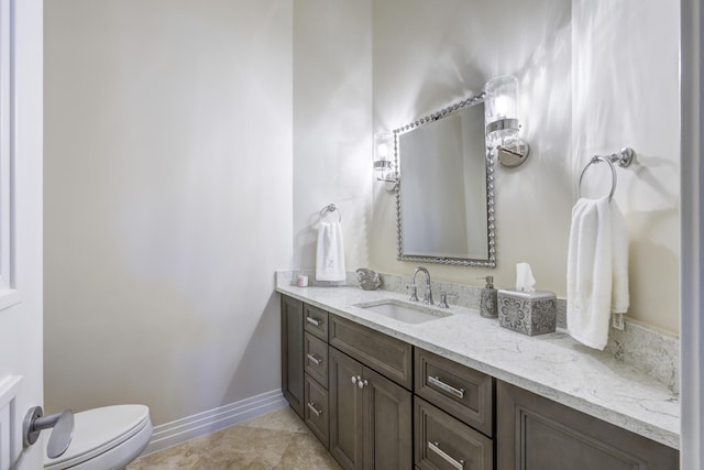 bathroom featuring vanity, toilet, and tile patterned flooring