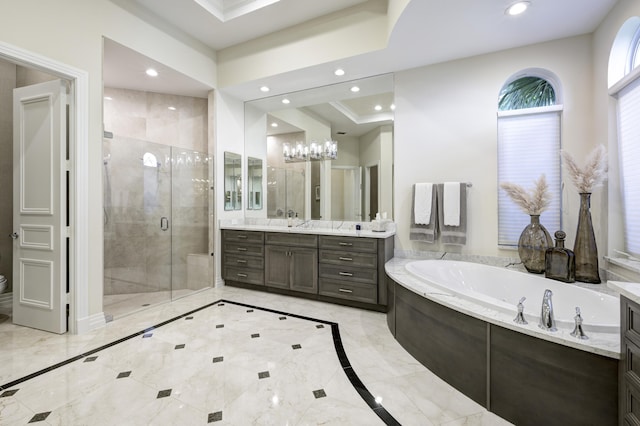 bathroom featuring vanity, plus walk in shower, and a raised ceiling