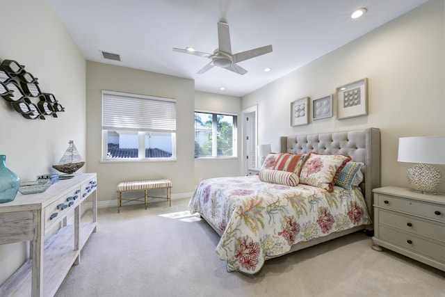 bedroom with light carpet and ceiling fan