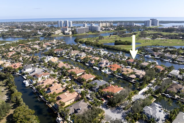 birds eye view of property with a water view