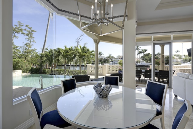 dining room featuring an inviting chandelier and crown molding