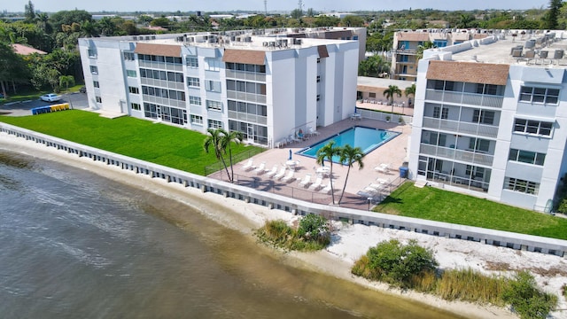 birds eye view of property with a water view