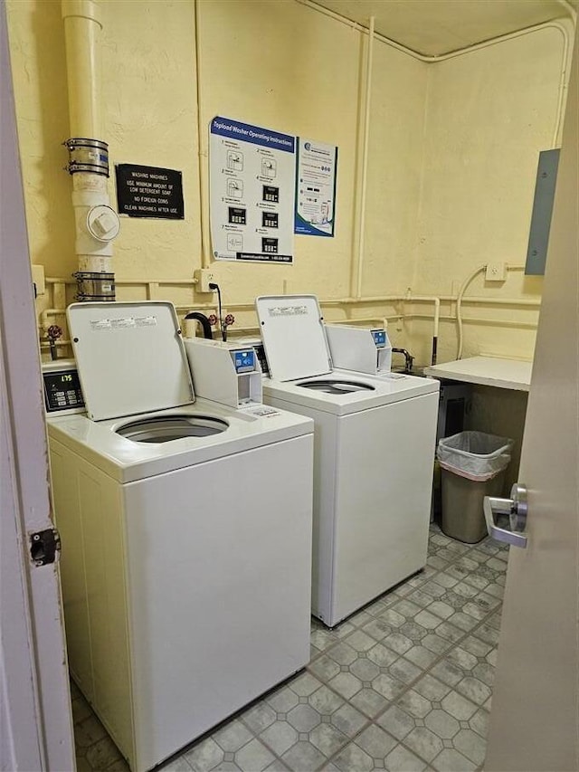 laundry area with washing machine and clothes dryer