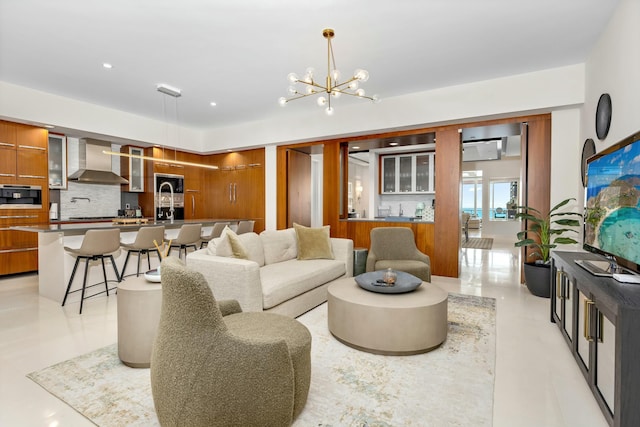 living room featuring an inviting chandelier and recessed lighting