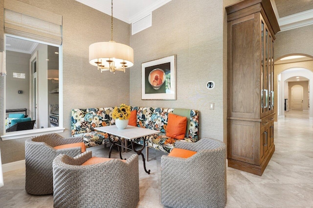 living room with a notable chandelier, crown molding, and a high ceiling