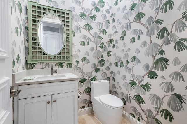 bathroom featuring vanity and toilet