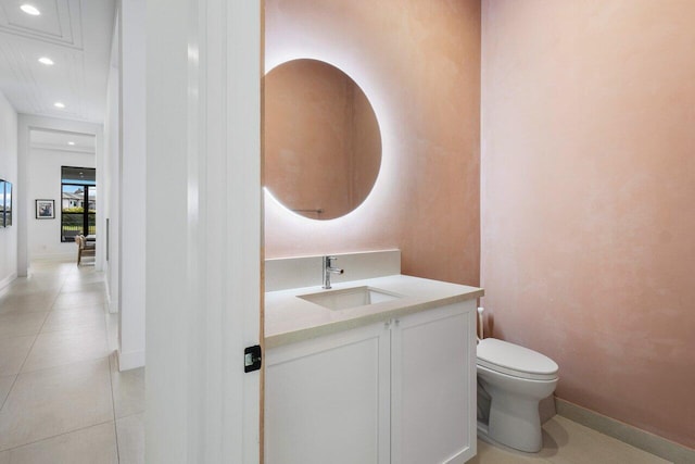 bathroom with vanity, toilet, and tile patterned flooring