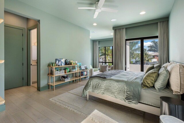 bedroom with ceiling fan and light hardwood / wood-style flooring