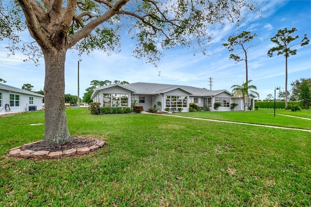 ranch-style home with a front yard