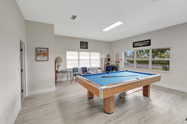 playroom featuring billiards, light hardwood / wood-style floors, and a healthy amount of sunlight