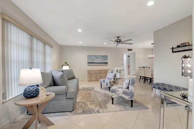 tiled living room featuring ceiling fan